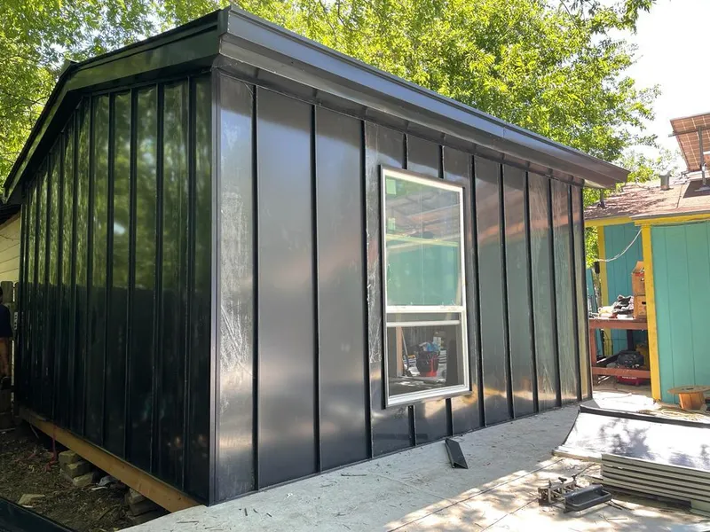 Black standing seam metal wall panels for Roof Inspection in Danville